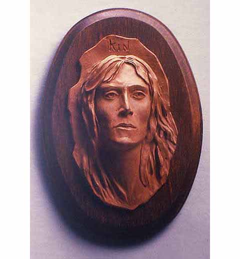 The Kin is a character from the book, "The Alchemists" by Geary Gravel. The terra-cotta bas-relief was done using Geary's description and guidance and was a gift to the author.